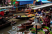 Thailand, Locals sell fruits, food and products at Damnoen Saduak floating market near Bangkok 